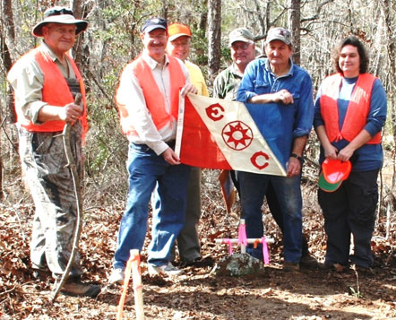 Lew and team of volunteers and archaeologists carry the Explorers Club Flag